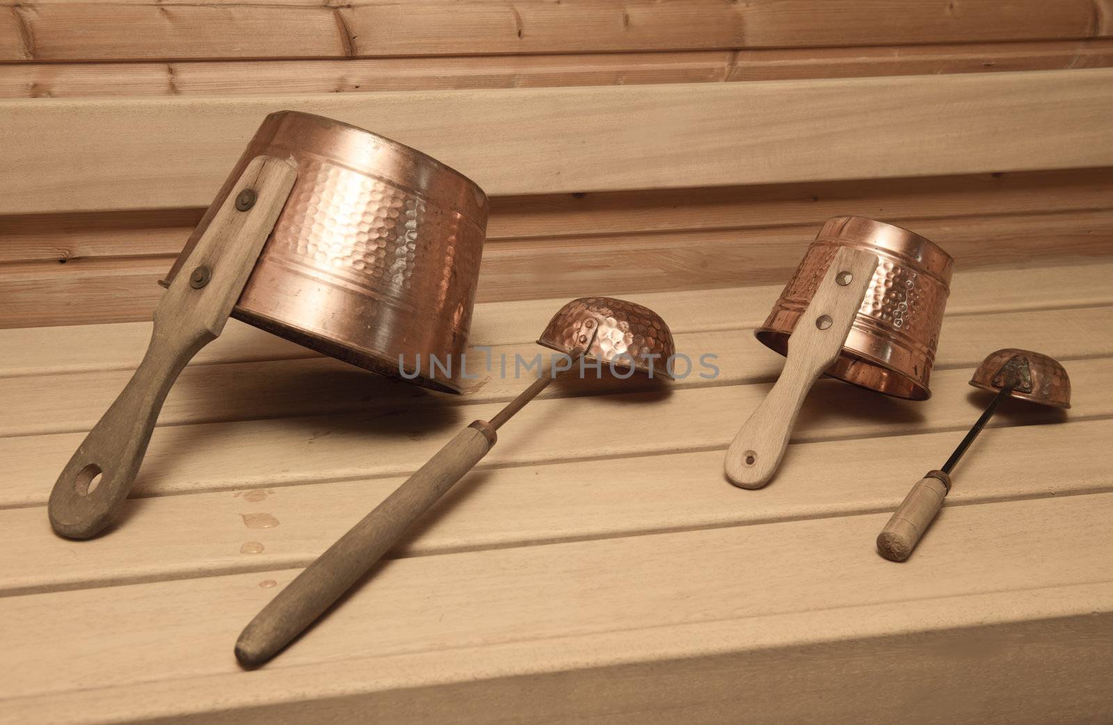 Two buckets for water with ladles in an interior of the Finnish sauna