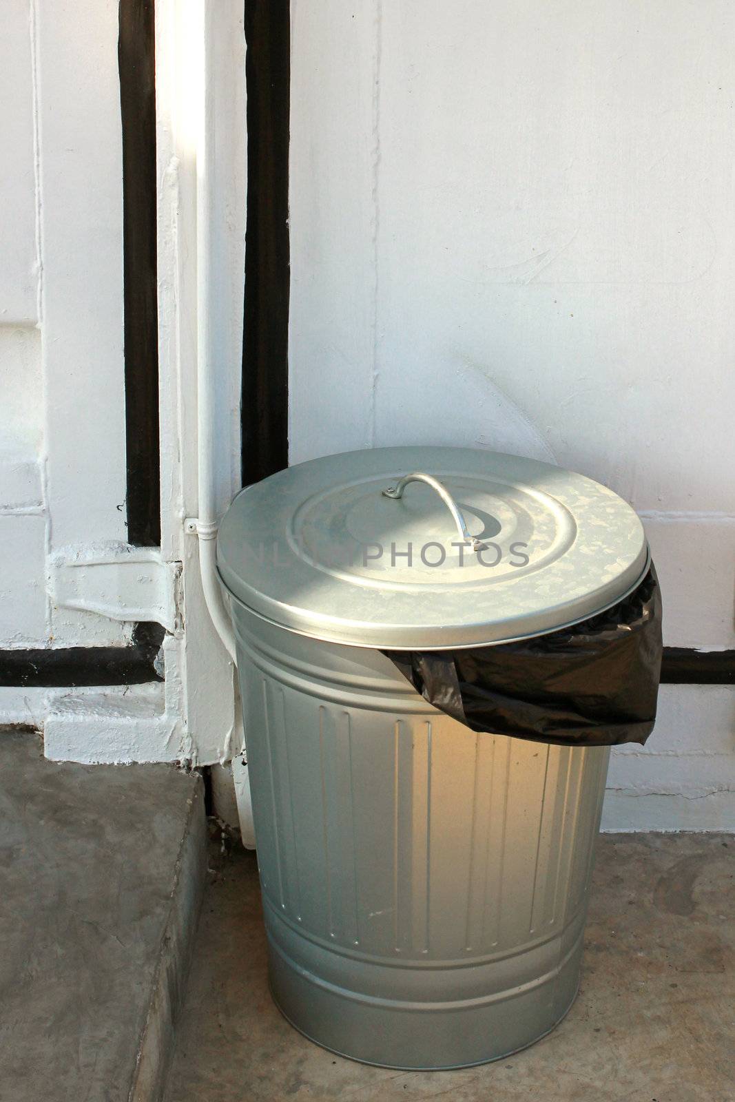 Steel trash can with black plastic by nuchylee