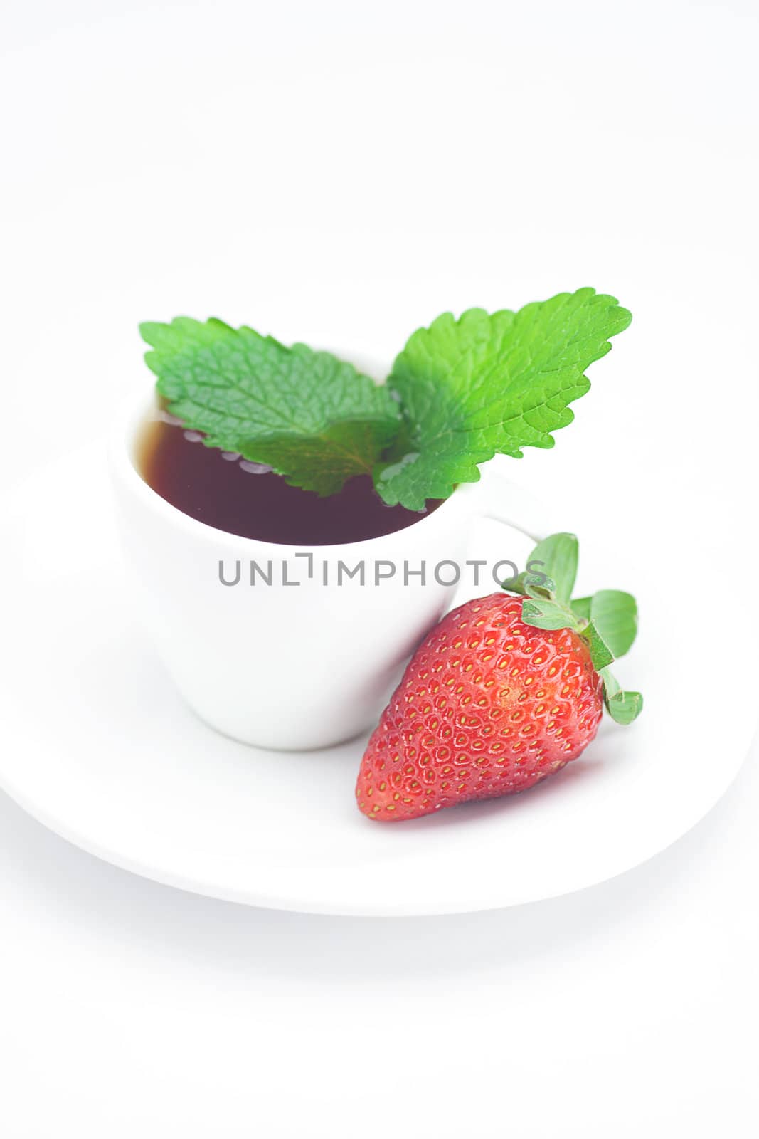 cup of tea,strawberry and mint isolated on white