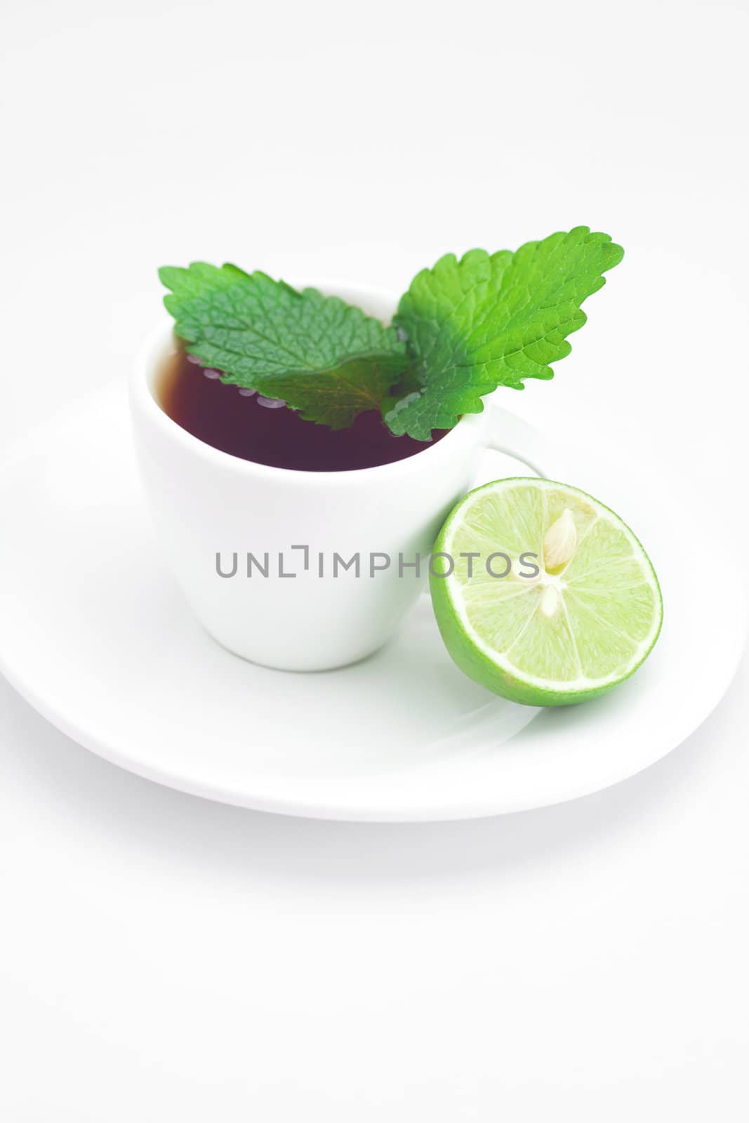 cup of tea,mint and lime isolated on white