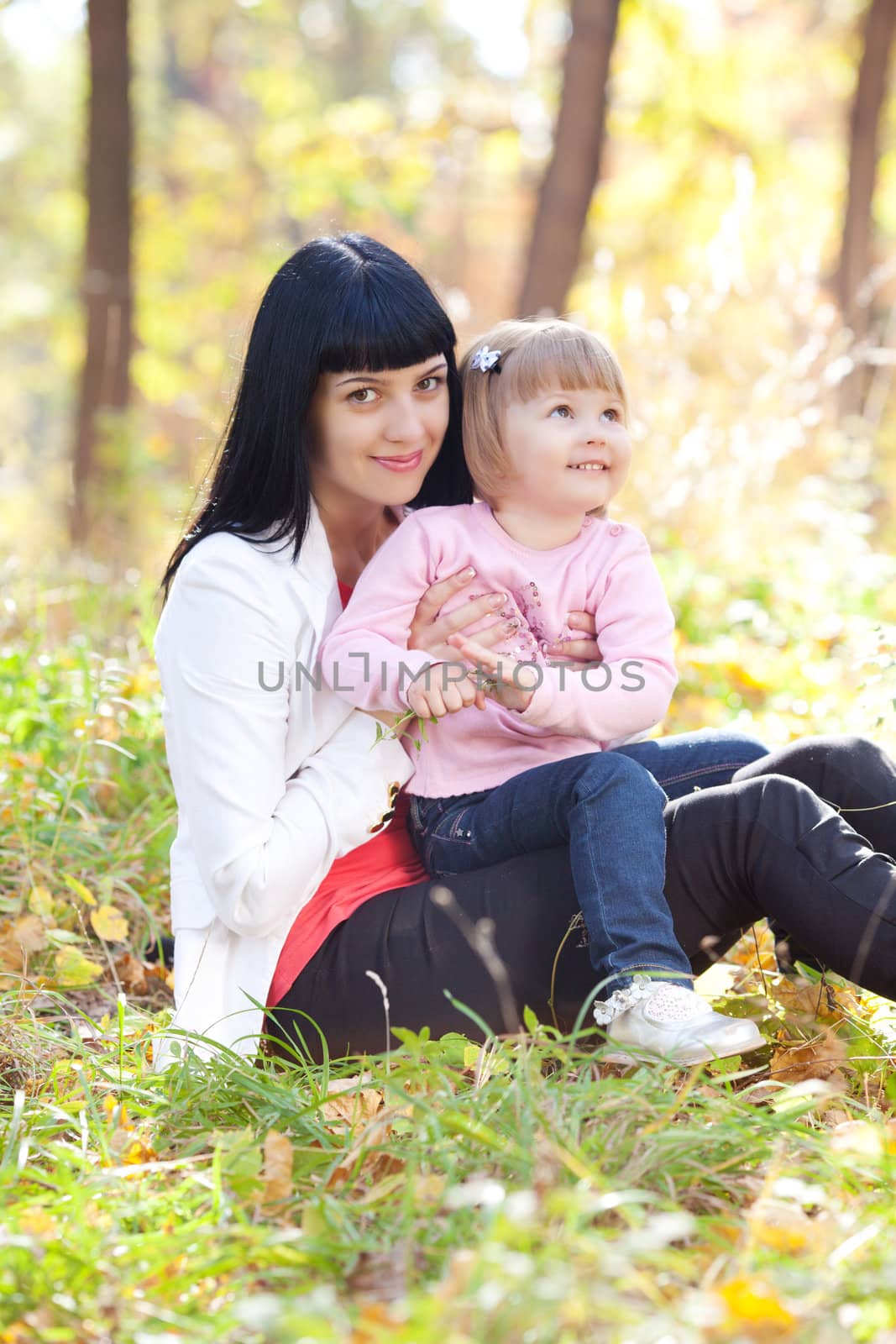 beautiful young mother and her daughter on the autumv forest by jannyjus