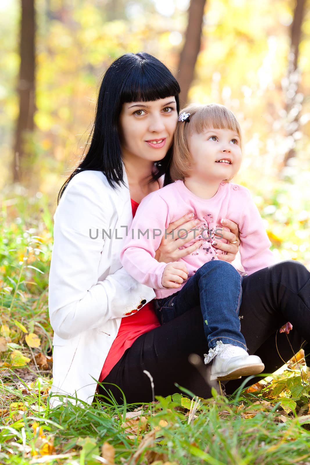 beautiful young mother and her daughter on the autumv forest by jannyjus