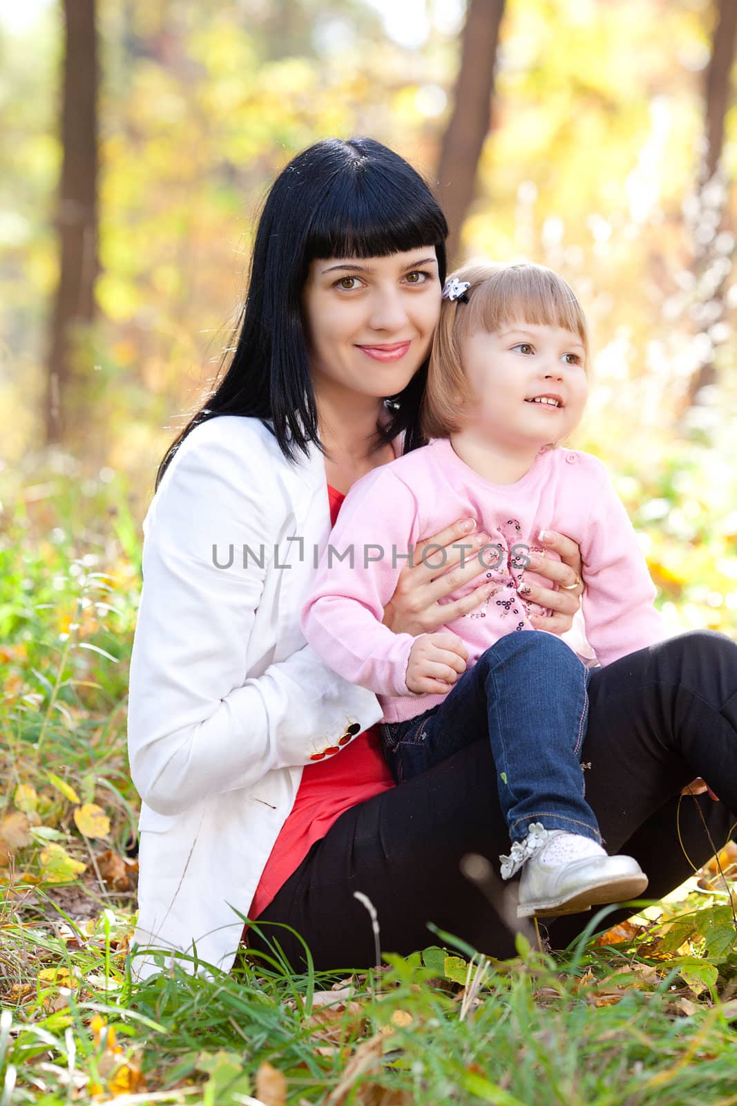 beautiful young mother and her daughter on the autumv forest by jannyjus