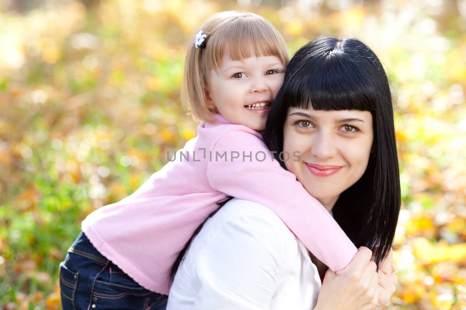 beautiful young mother and her daughter on the autumv forest by jannyjus