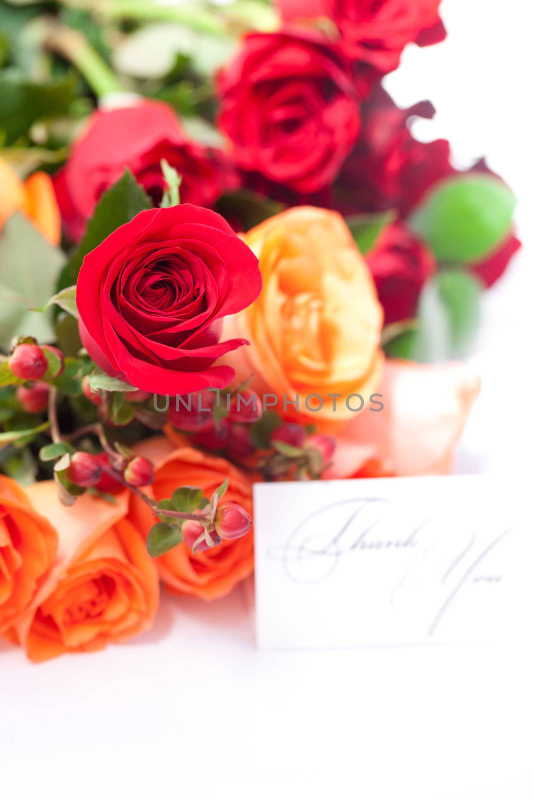 bouquet of colorful roses and a card with the words thank you by jannyjus