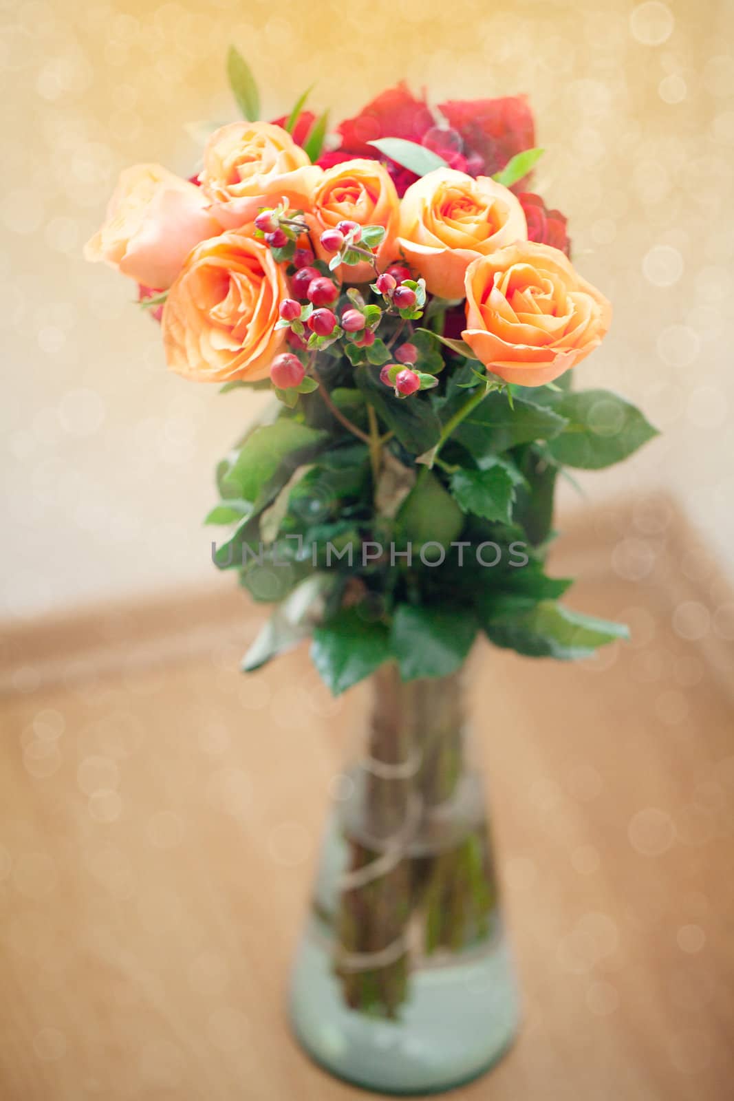 bouquet of colorful roses in vase with bokeh