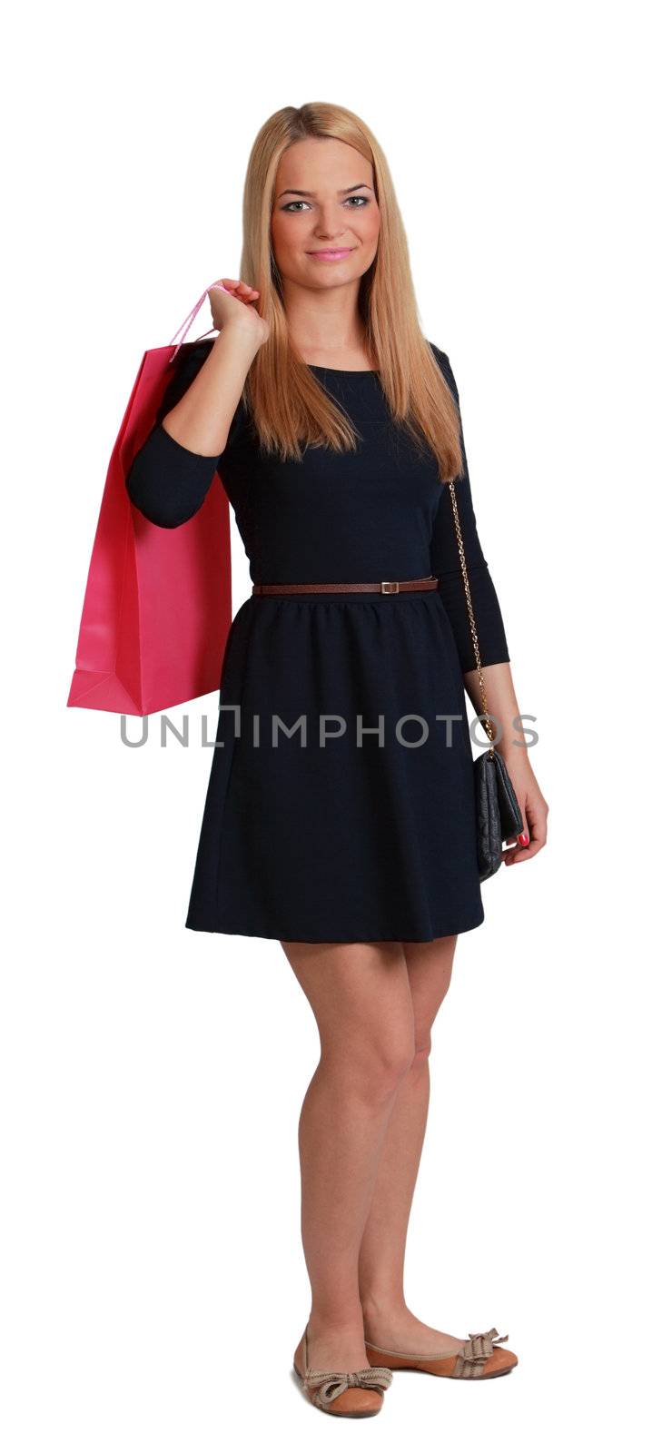 Young blonde woman with a pink shopping bag over her shoulder stands against a white background.