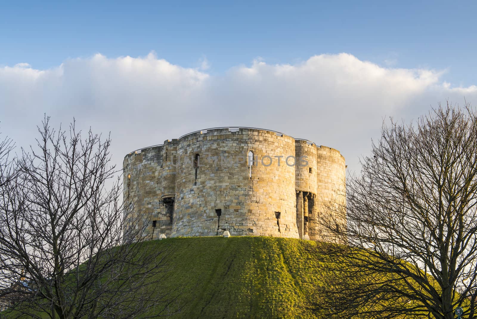 North face of Clifford's Tower, in York, UK. The tower is part of the York castle.