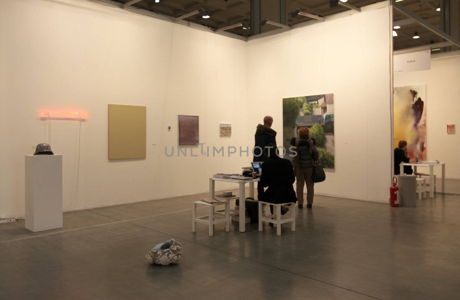 People visit paintings gallery at MiArt, international exhibition of modern and contemporary art April 07, 2013 in Milan, Italy.
