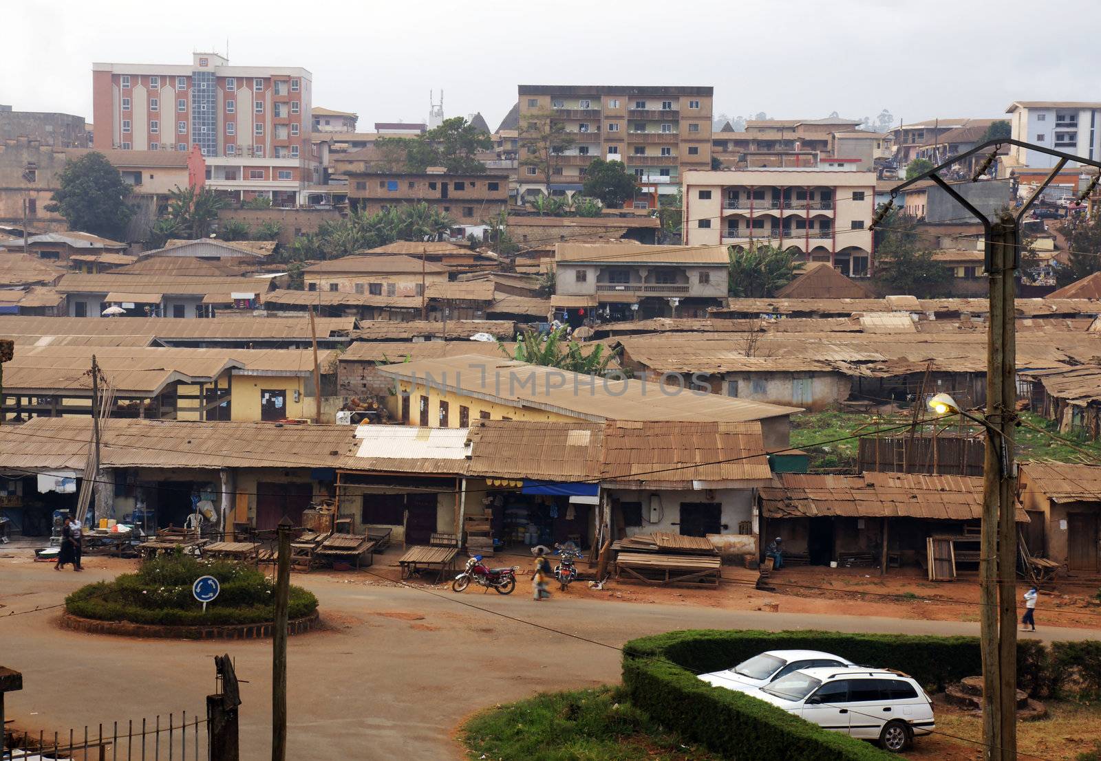 African city with typical little shops along the streets and tin roofs.