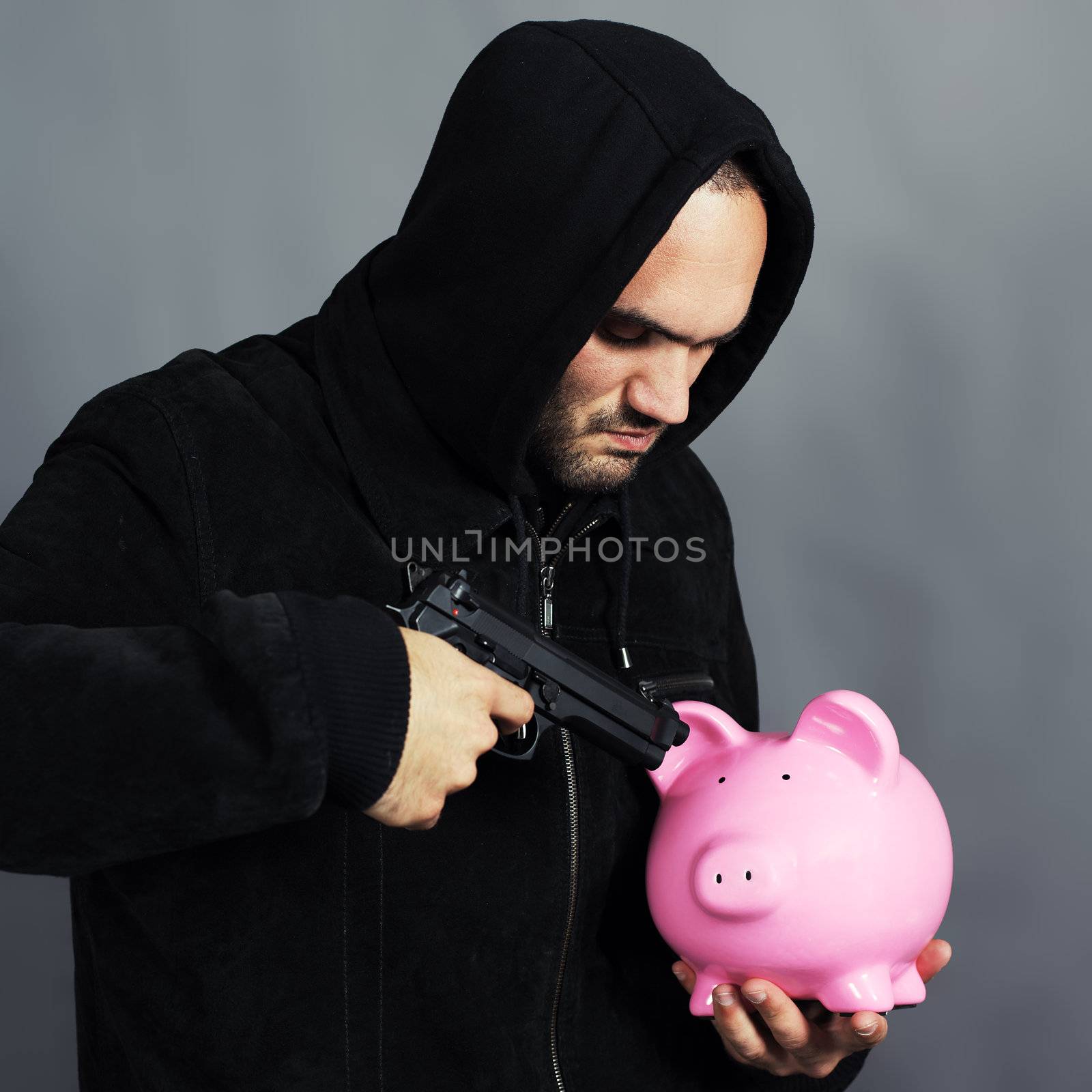 bad boy with pink piggy bang and gun in the hand