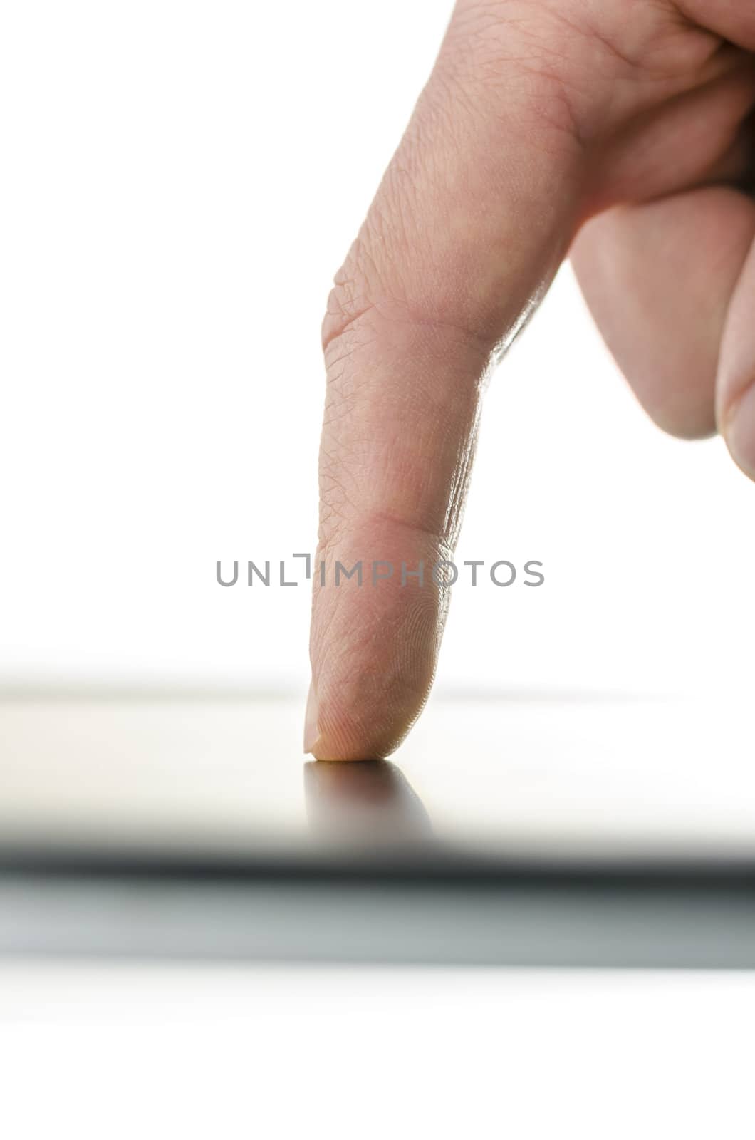 Close up of male finger composing a message on a smart phone device. Over white background.