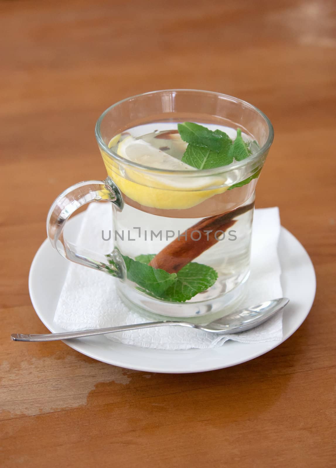 cup of mint tea with lemon and cinnamon