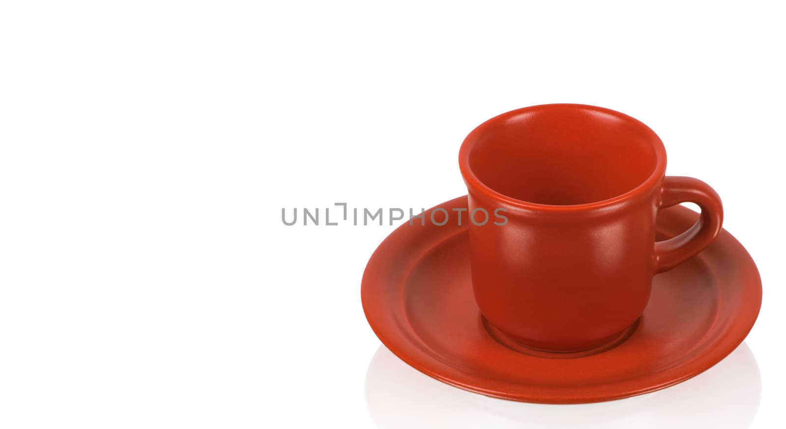 Red cup on a red saucer isolated on white background