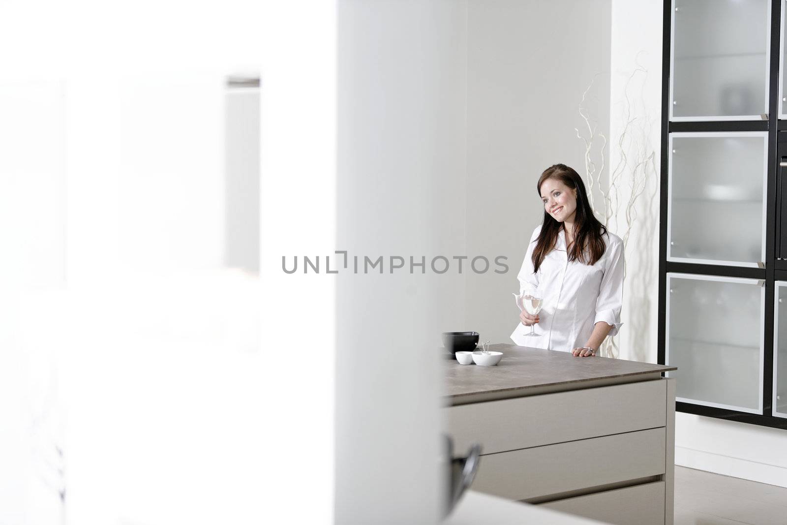 Woman in her stylish kitchen by studiofi