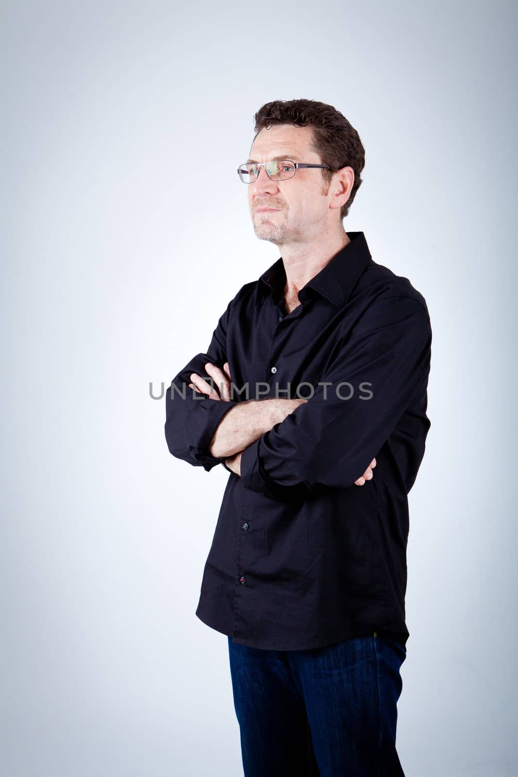 attractive adult man with glasses and black shirt portrait 