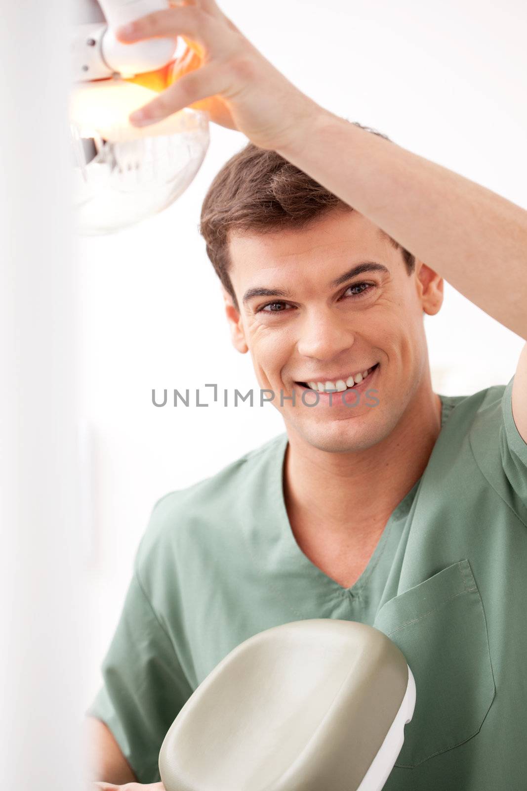 Portrait of Smiling Dentist by leaf