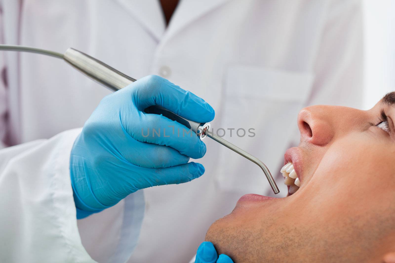 Dentist working on patient at clinic