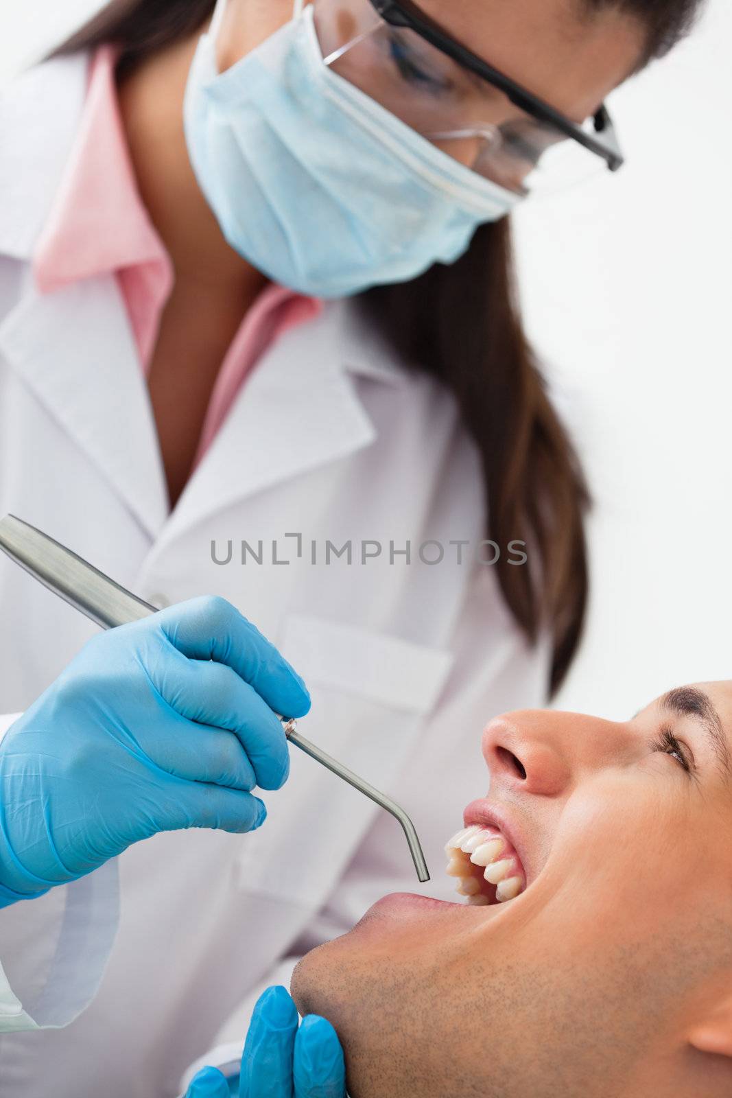 Male patient at dentist's clinic by leaf