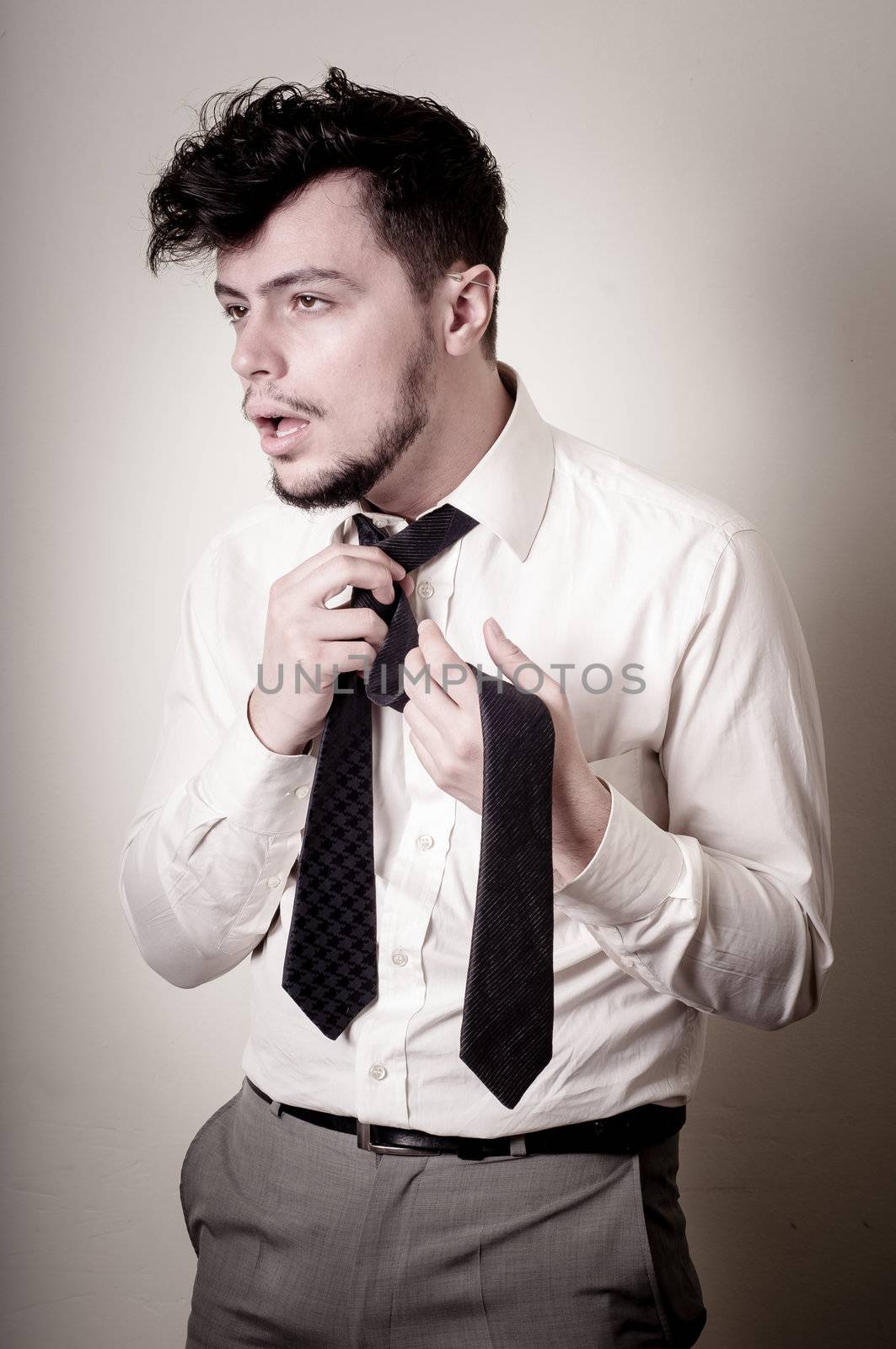 stressed businessman on gray background