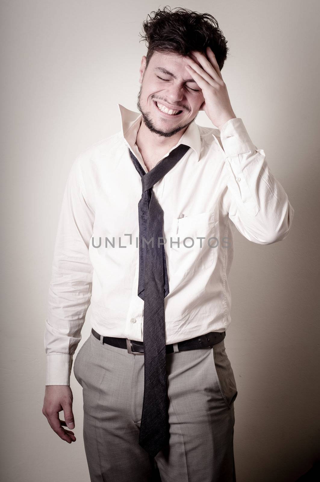 stressed businessman on gray background