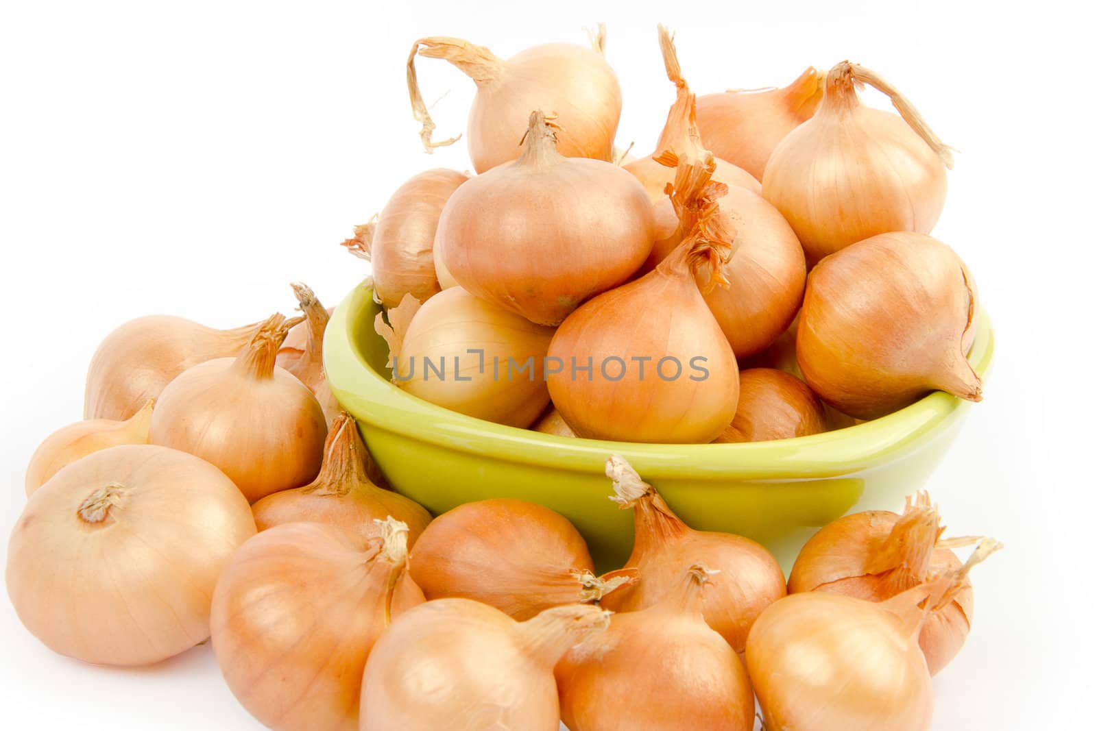A bowl full of onions on white background by velislava
