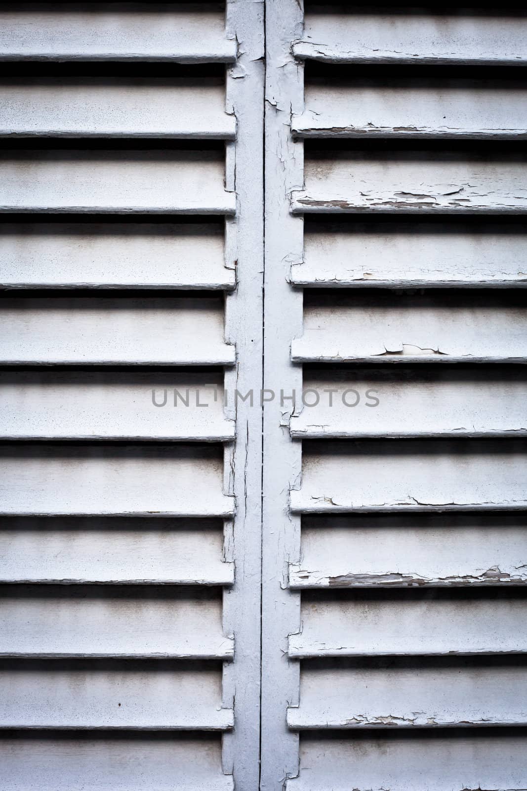 Close up of weathered wooden window shutters