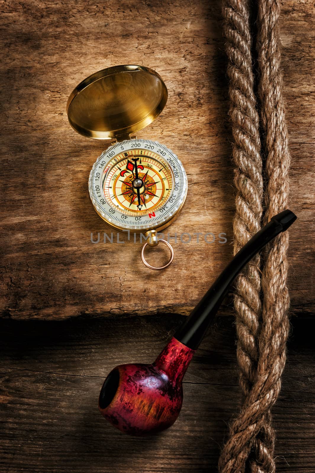 Compass and a pipe with a rope by oleg_zhukov