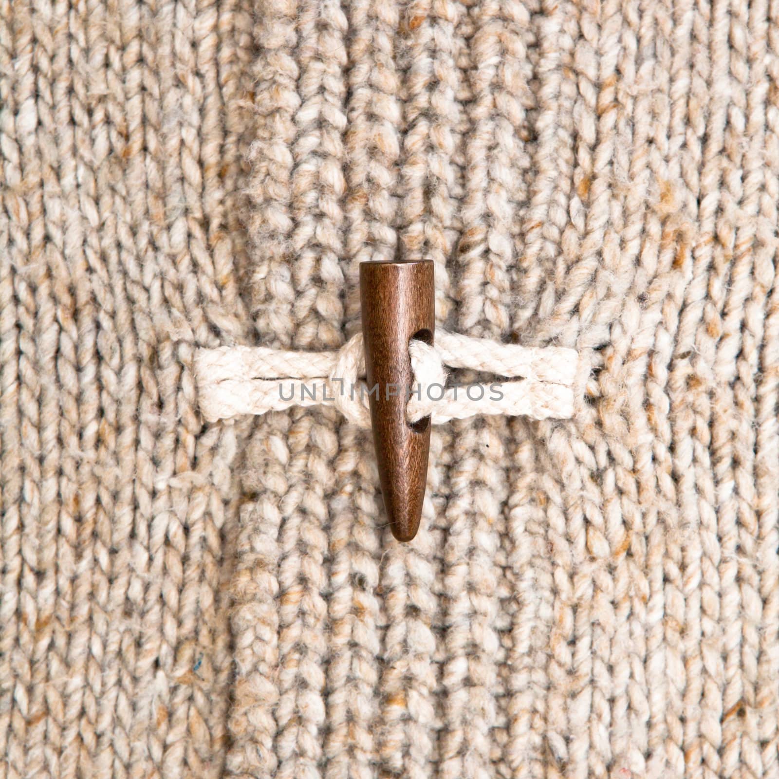 Close up of the toggle on a warm winter jumper