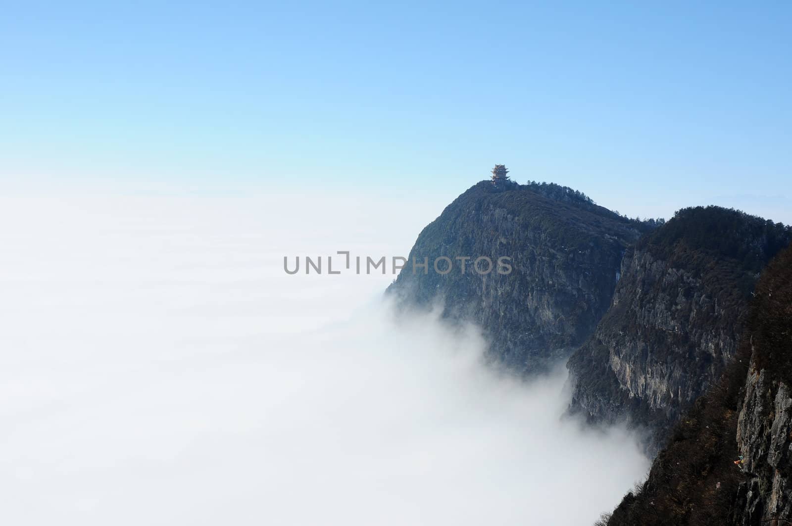 Landscape of moutains tops with clouds and blue sky