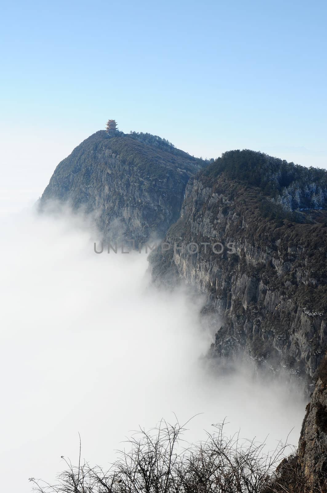 Landscape of moutains tops with clouds and blue sky