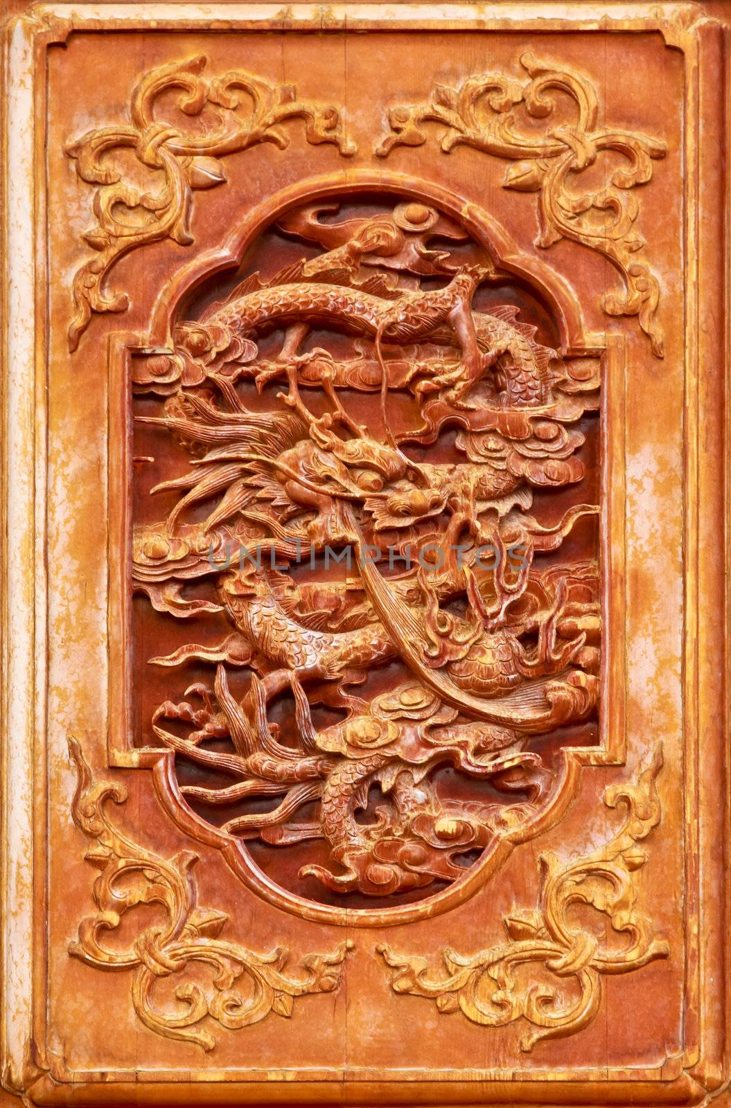 Dragon design on the wooden door of Chinese temple