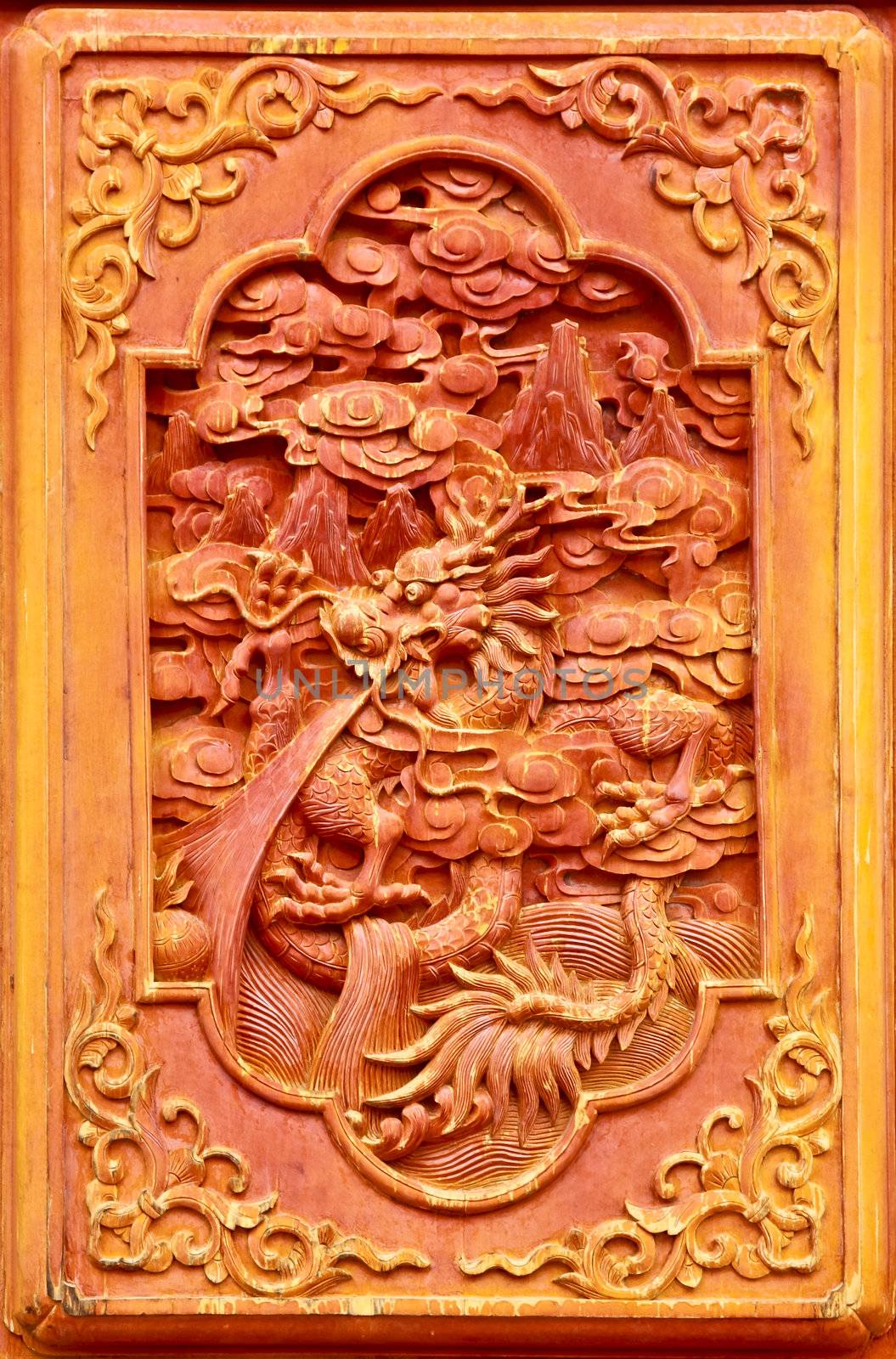 Dragon design on the wooden door of Chinese temple