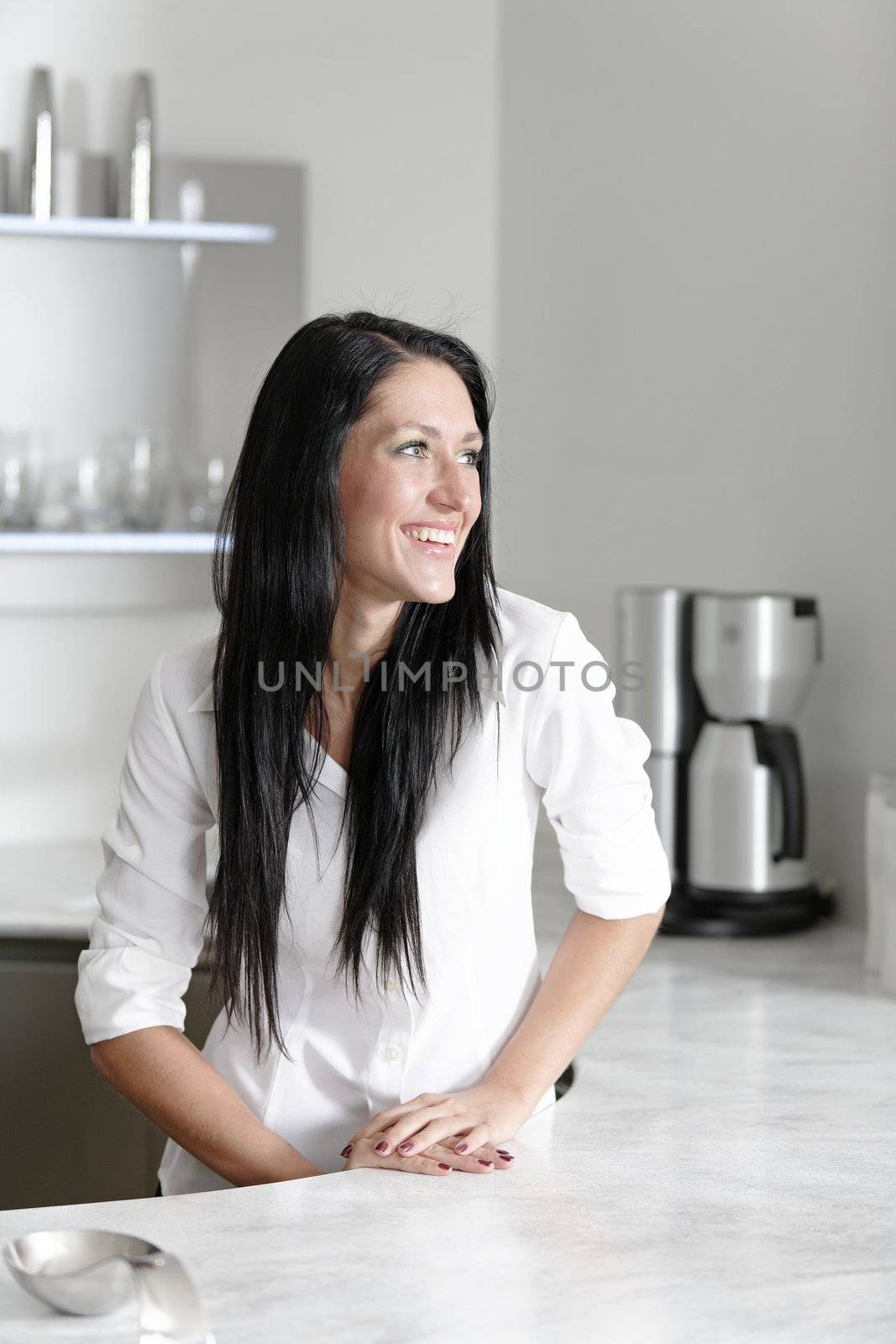 Woman in a white kitchen by studiofi
