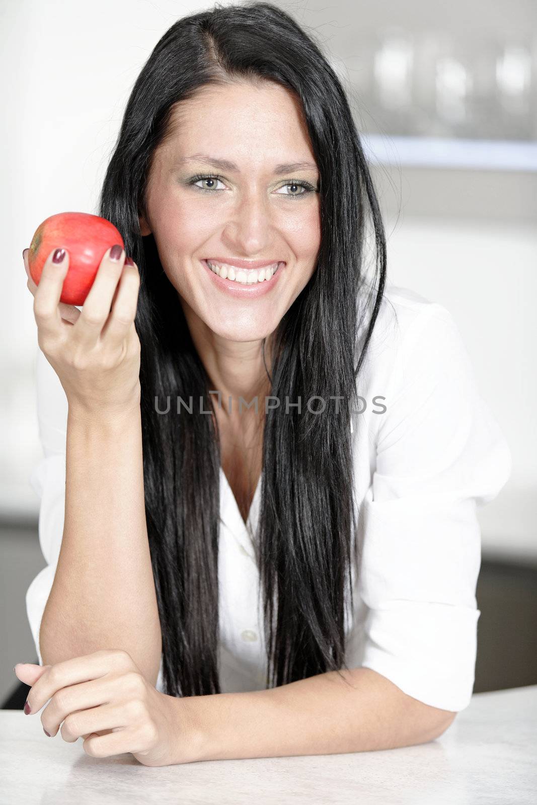 Woman eating an apple by studiofi