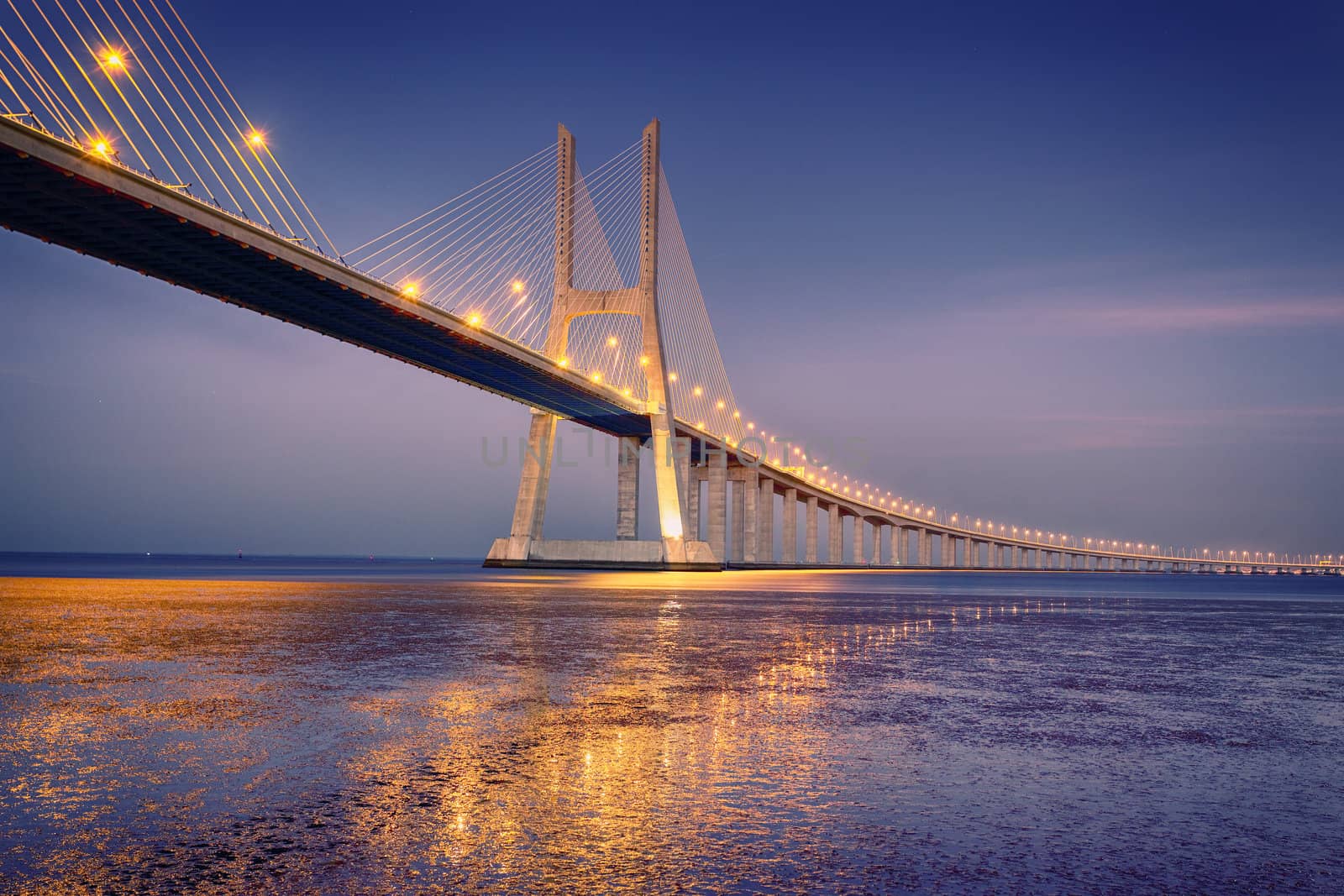 sunrise on Vasco da Gama bridge in Lisbon, Portugal 