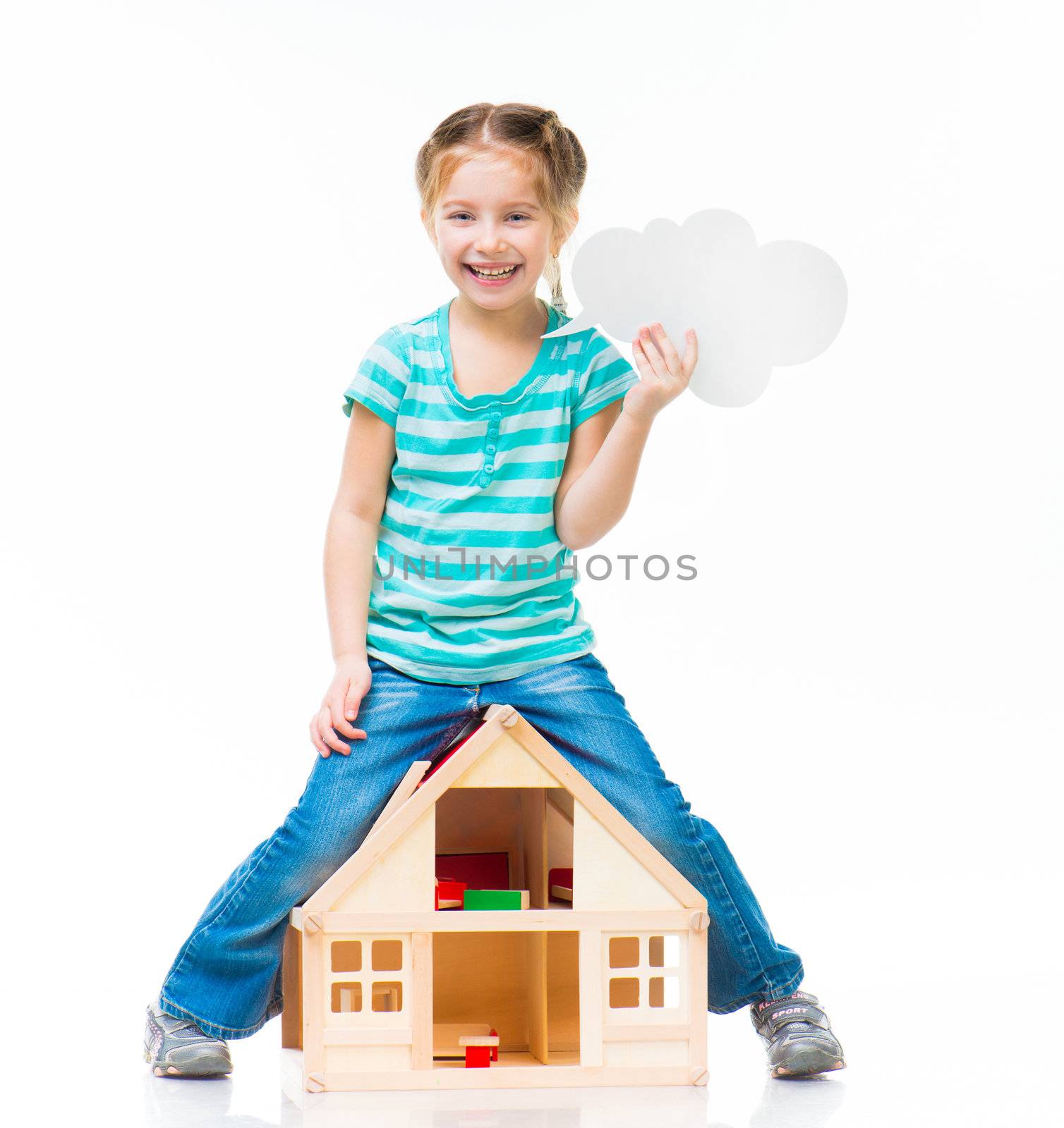 girl standing over the toy house with cloud talk