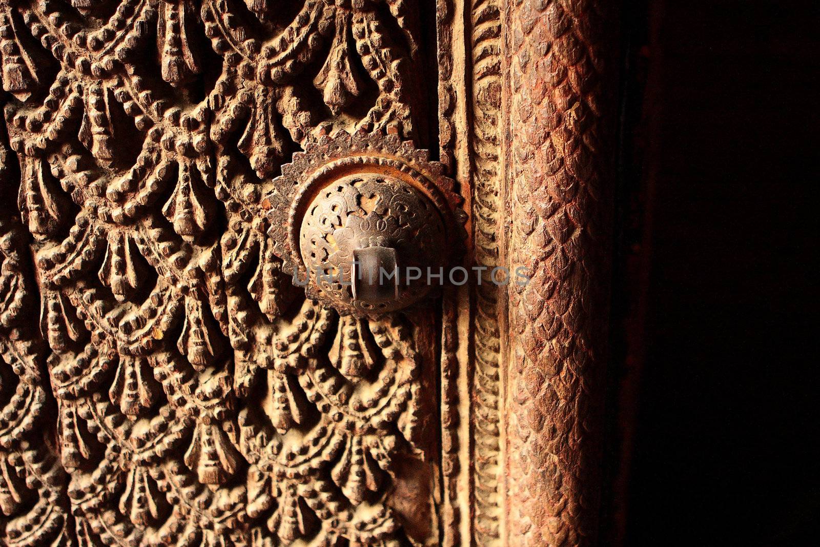 A fragment of a carved wooden door in Kathmandu, Nepal  Godness Sri Kumari house