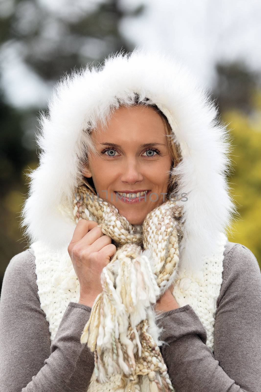 portrait of beautiful woman with blue eyes in winter