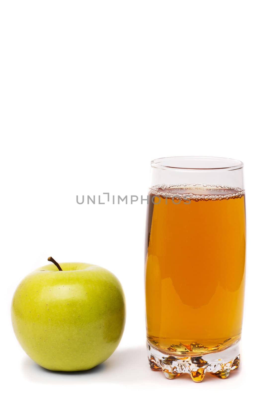 glass of apple juice and green apples isolated on white