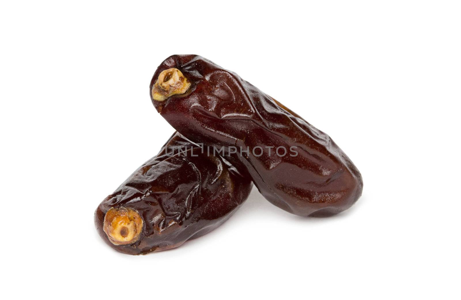 dryed dates on white background