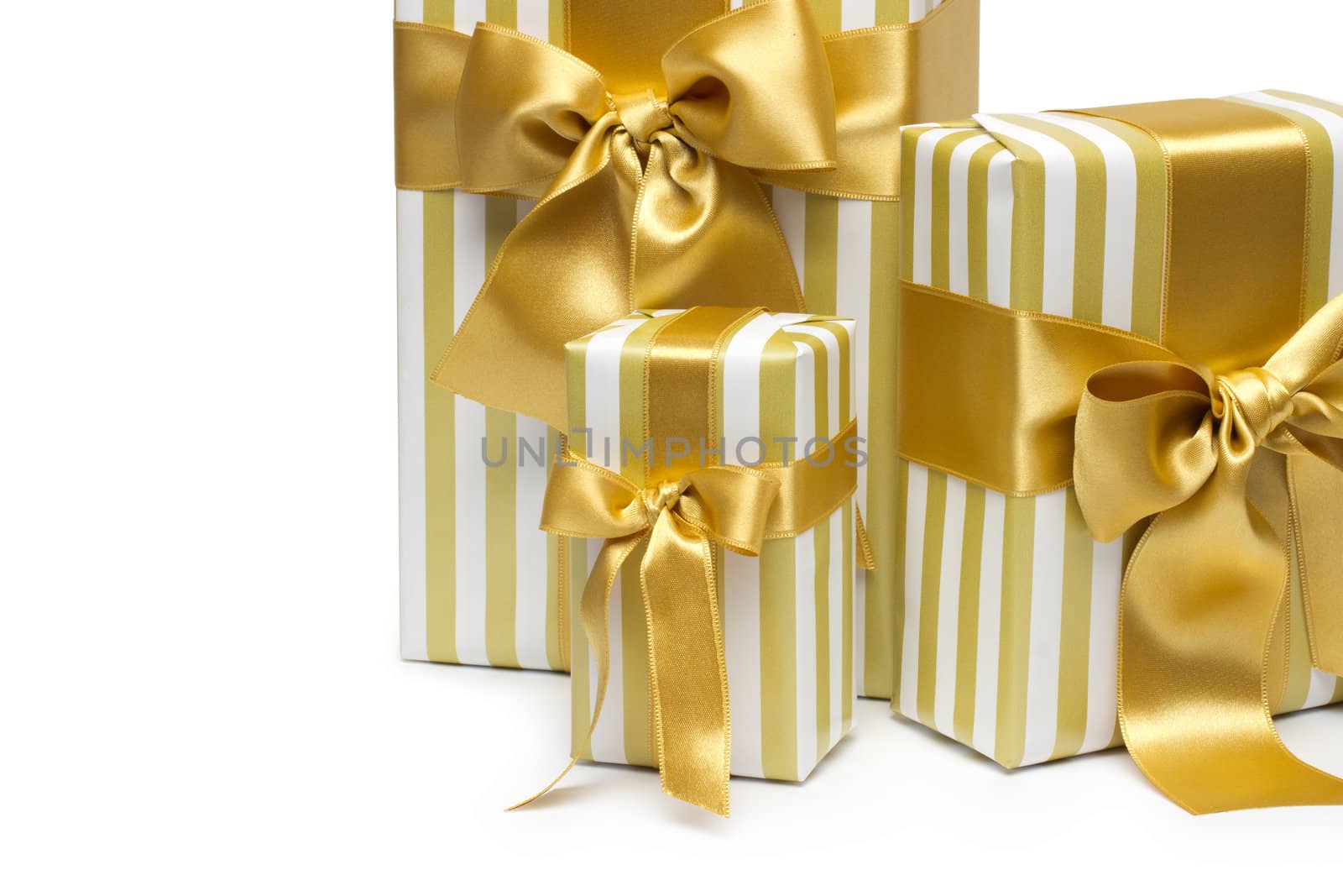 Gold gift boxes isolated on white background