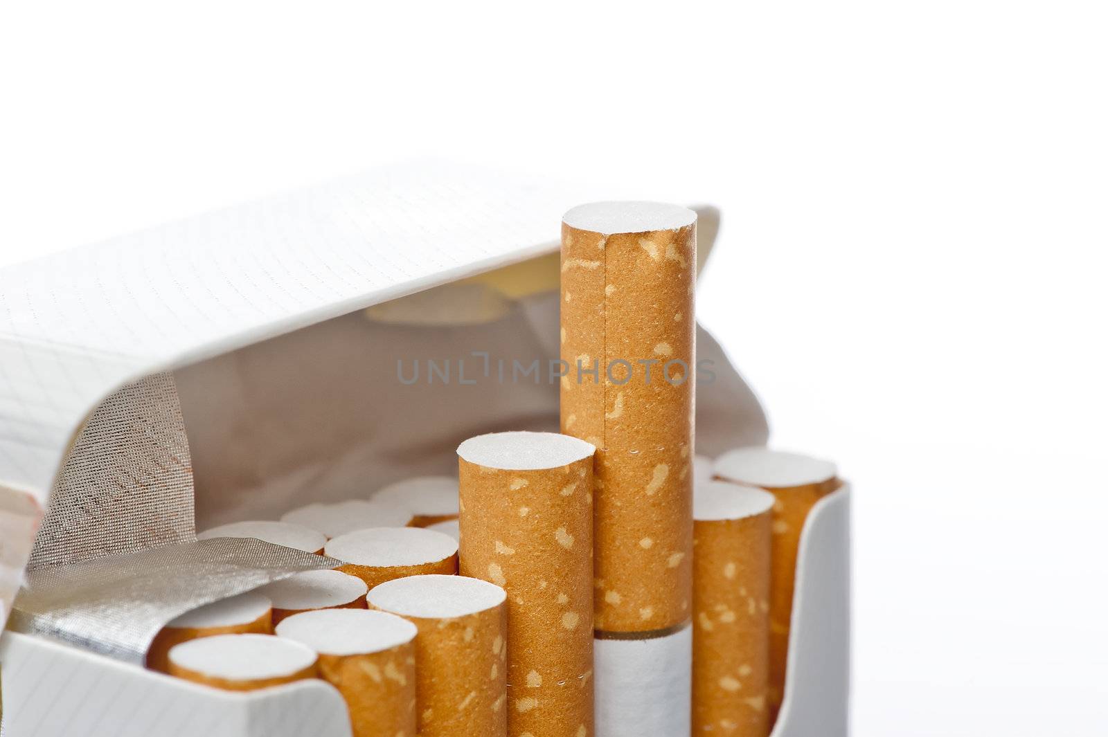 Open pack of cigarettes on a white background