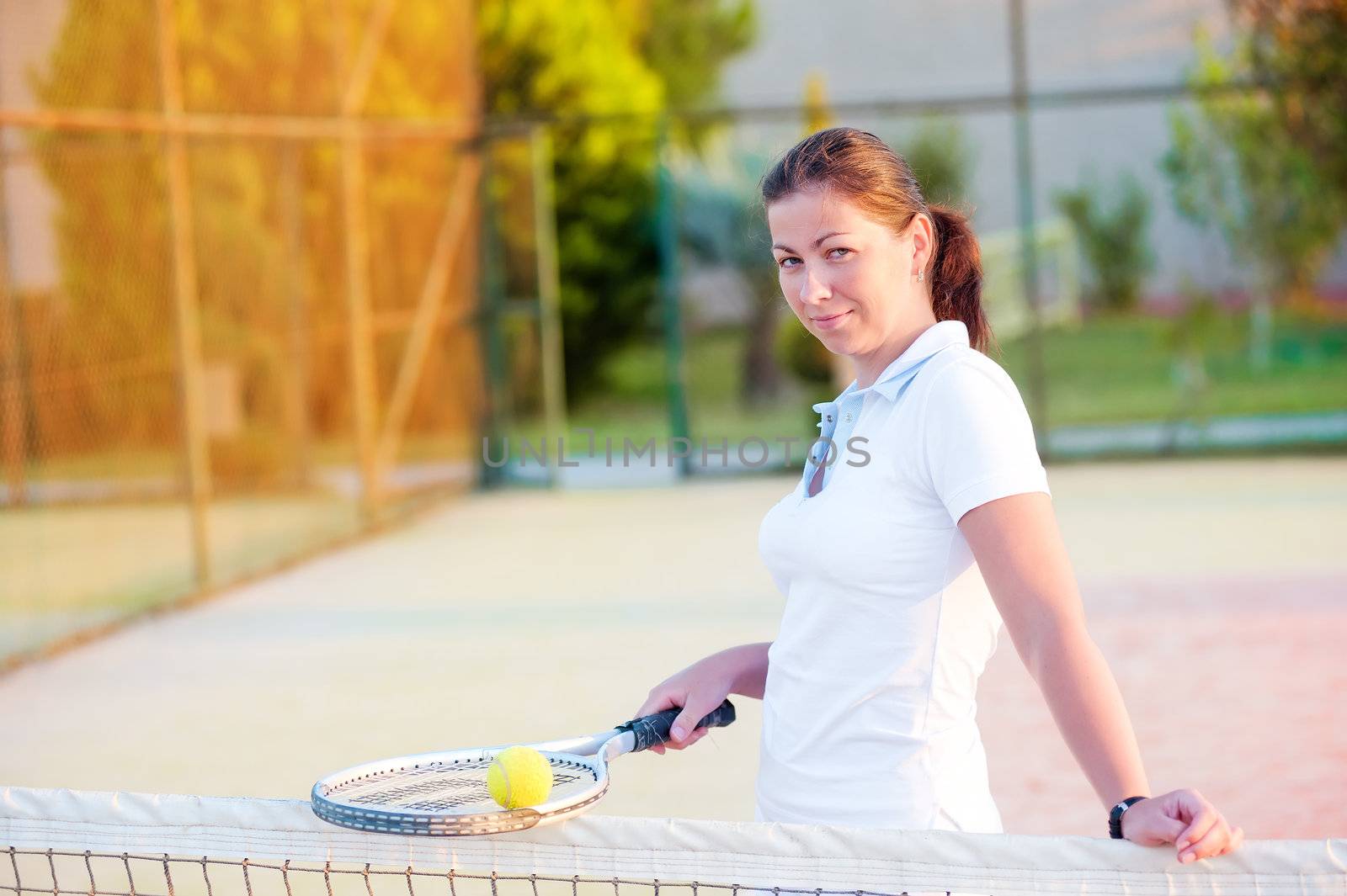 Young happy girl with a tennis racket by kosmsos111