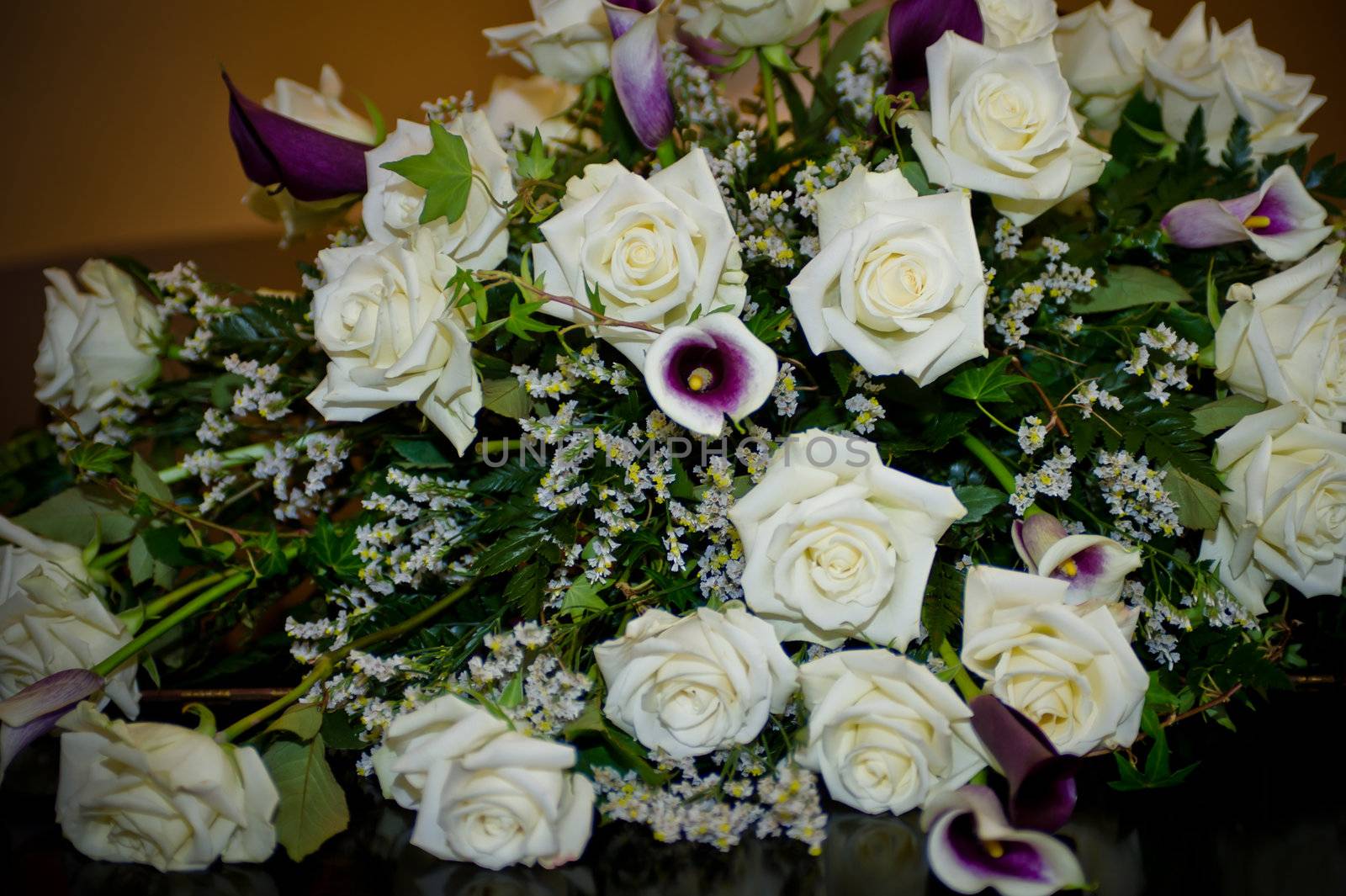 Bouquet of white roses and white and purple calla lilies