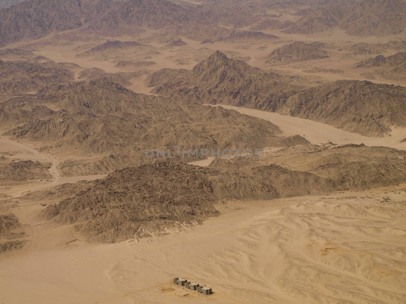 Aerial View of three apartment buildings in the desert
