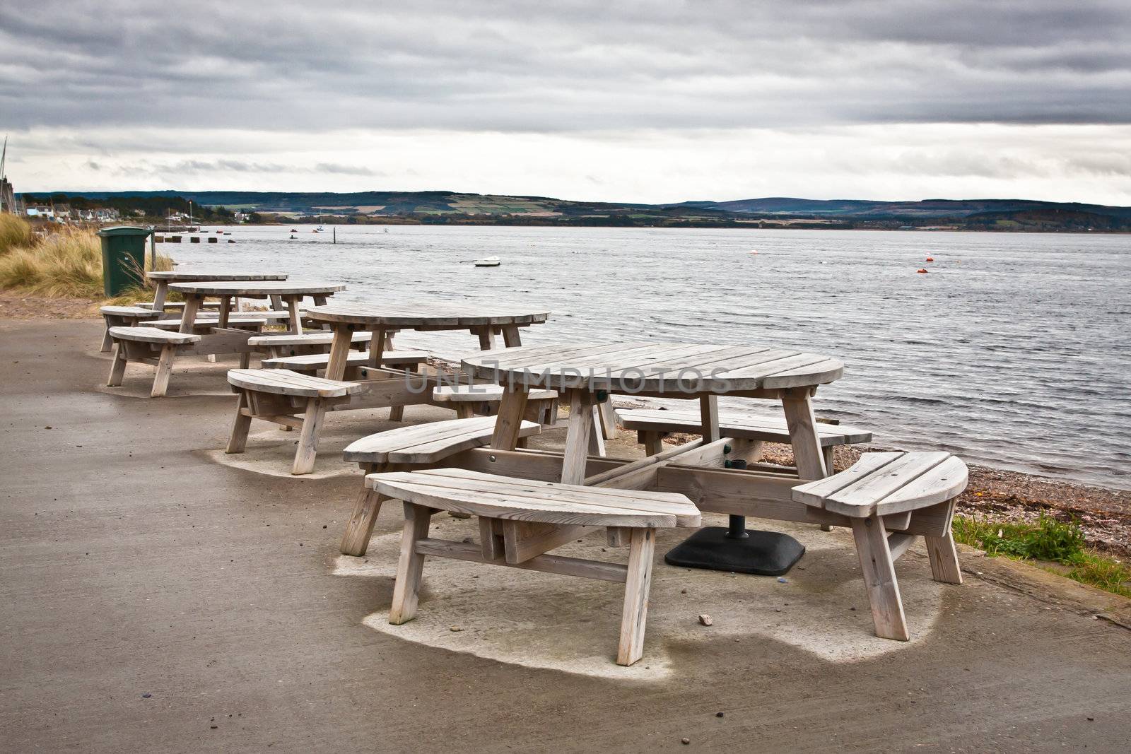 Wooden picnic tables at a seaside cafe in Findhorn, Scotland