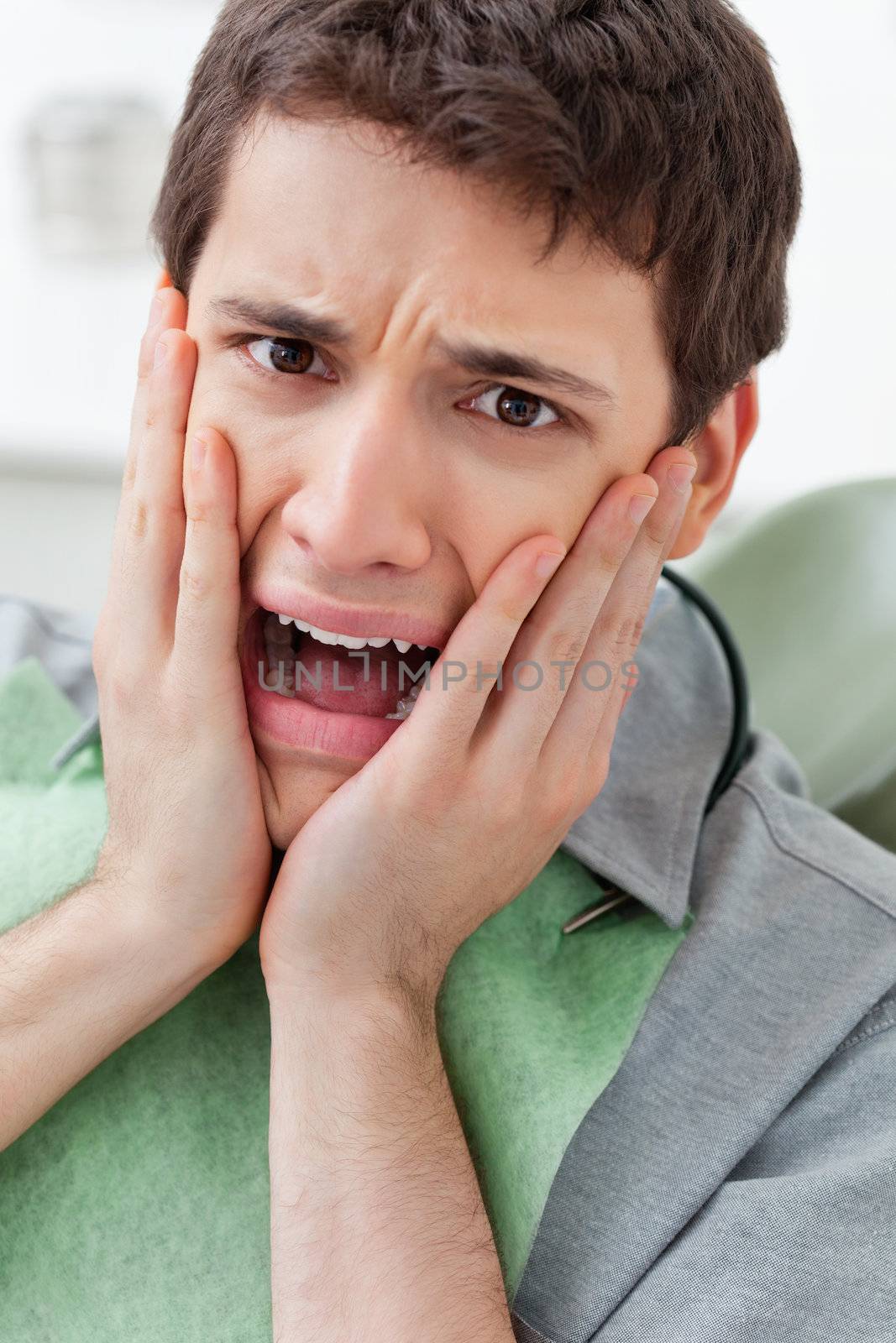 Scared man in Dental Clinic by leaf