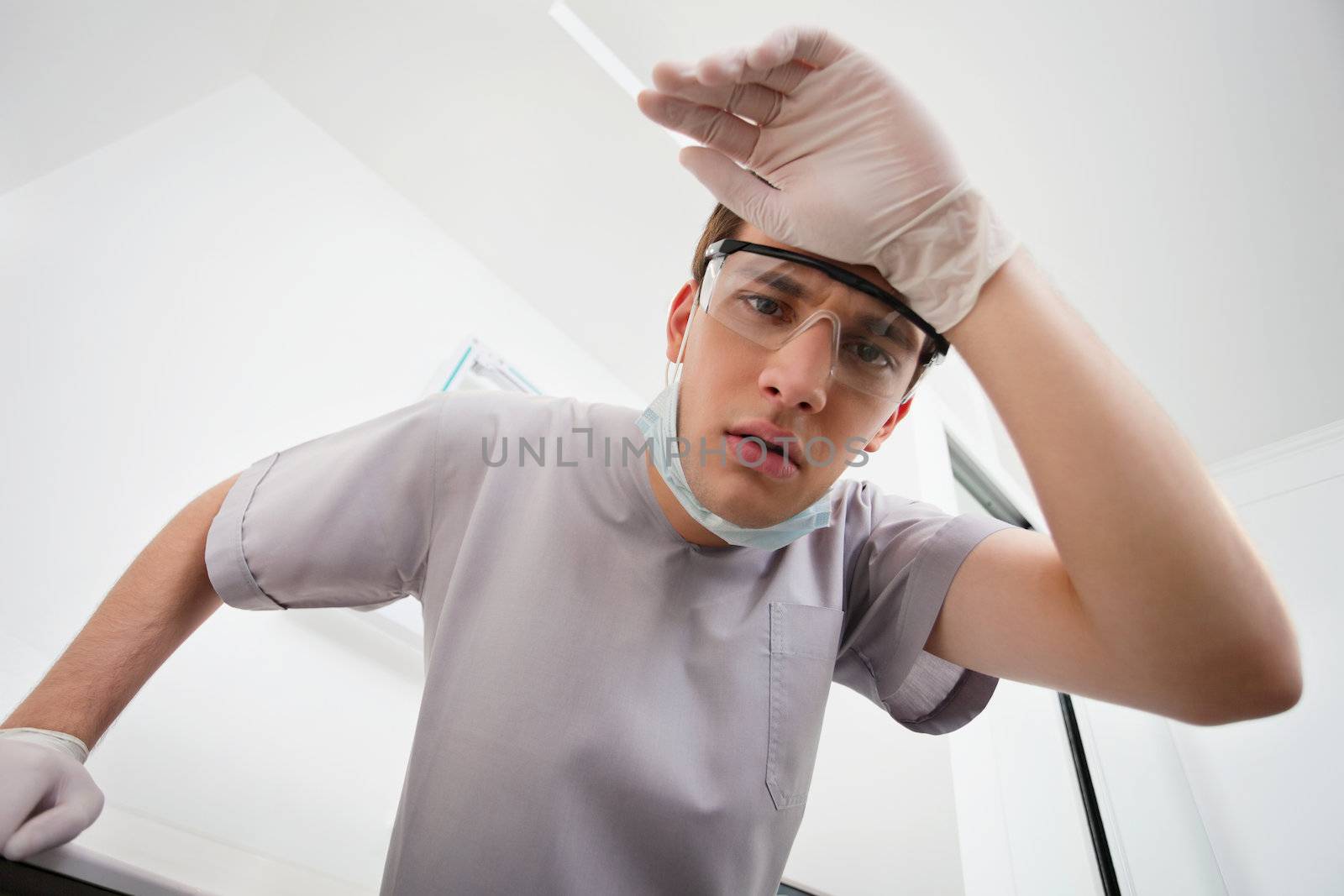 Worried dentist by leaf