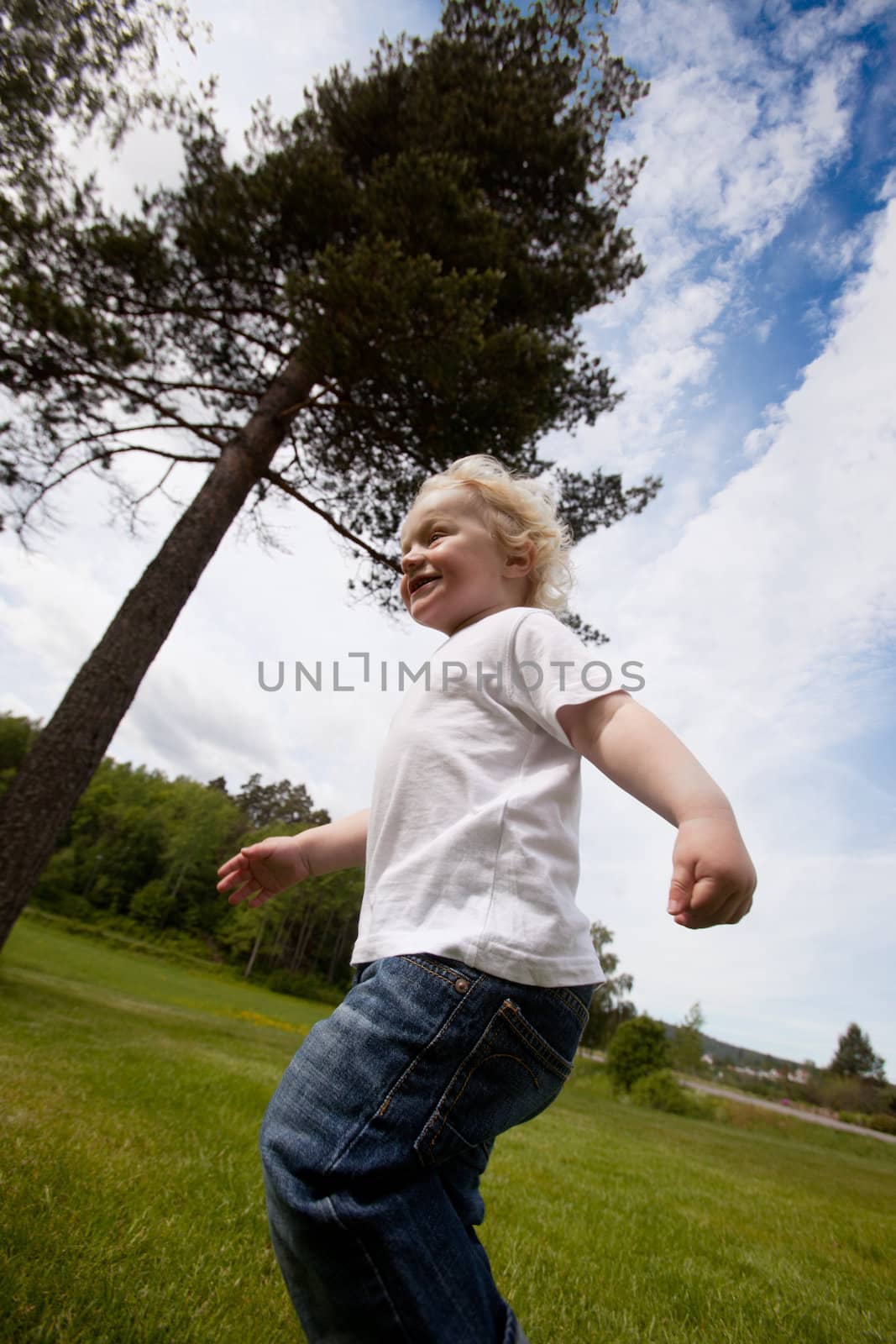 Boy Running Outside by leaf